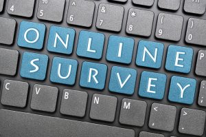 Blue online survey key on keyboard